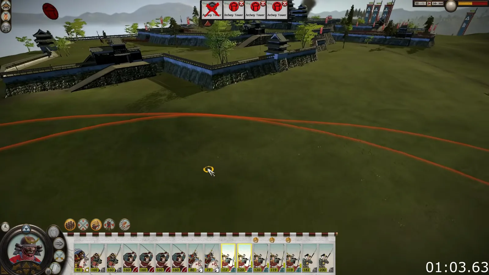 The classic Shogun 2 siege interface shows a multi-tier castle, gate approaches and a missile range boundary outside its walls.
